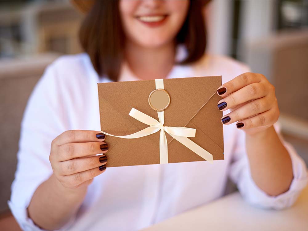 Woman giving a donation as a gift.