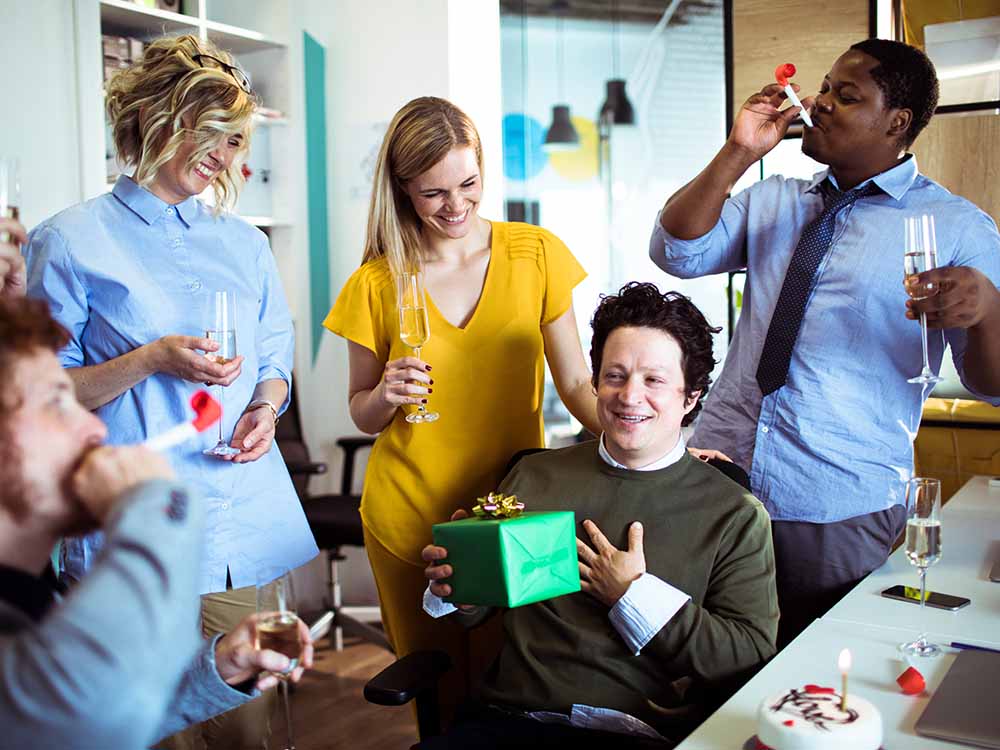 Team at work giving a gift.