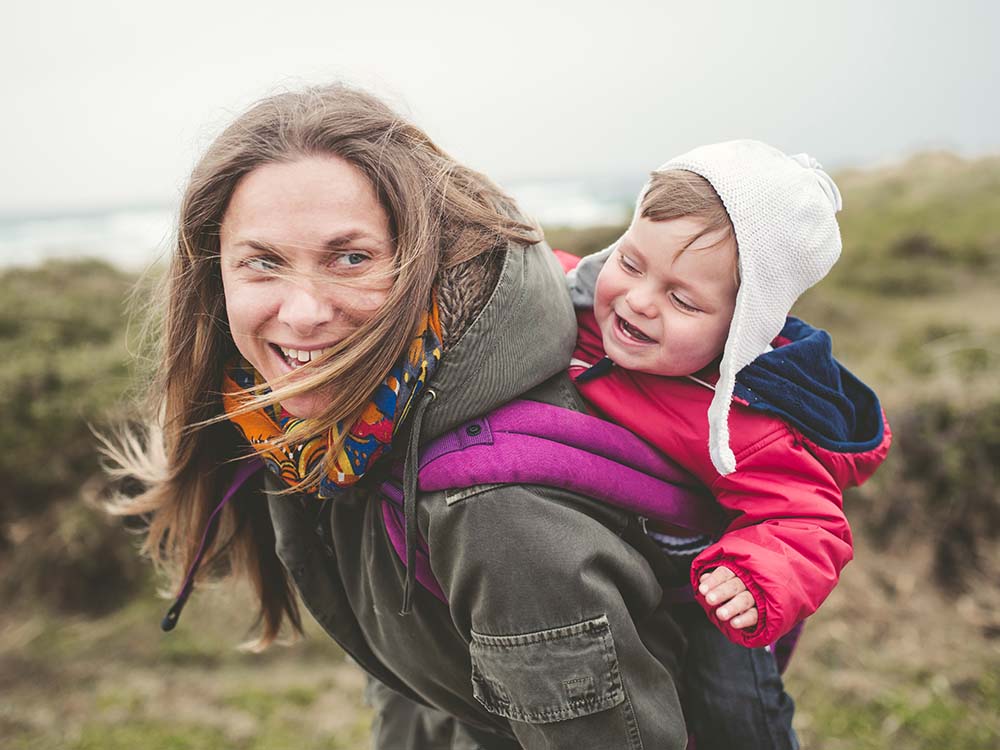 Mom hiking with her daughter.