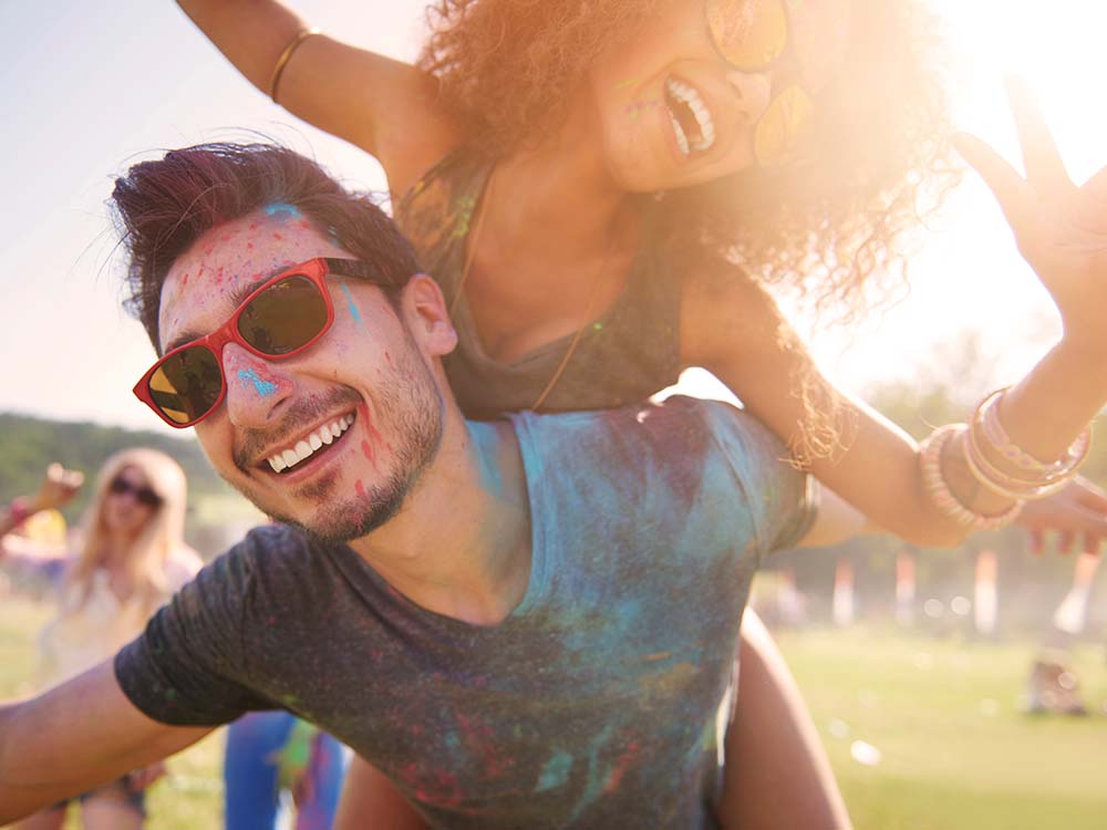 Couple having fun at a birthday party together.
