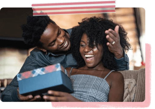 Couple enjoying opening a gift
